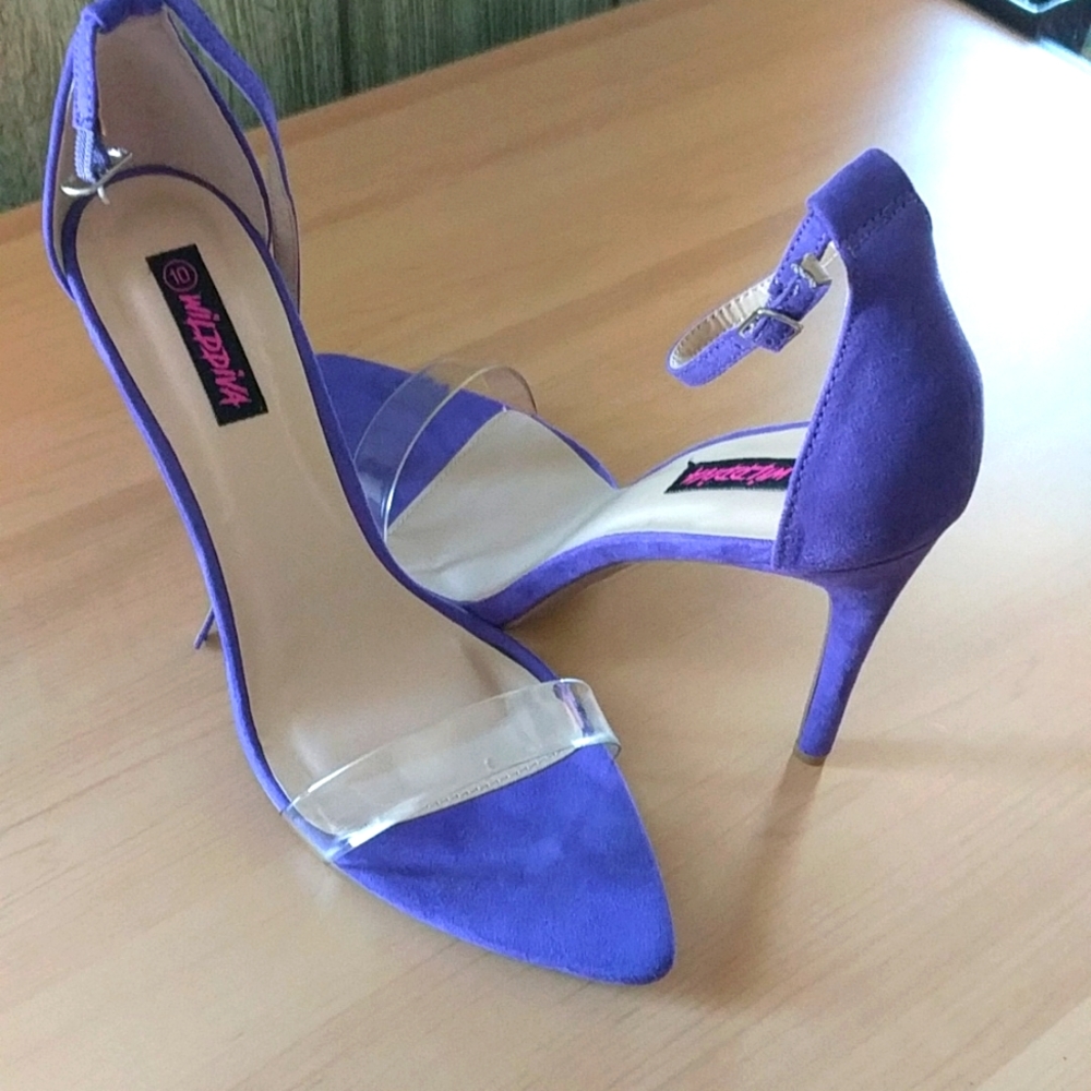 Purple open toe with plastic strap across foot high heel size 10 sandal